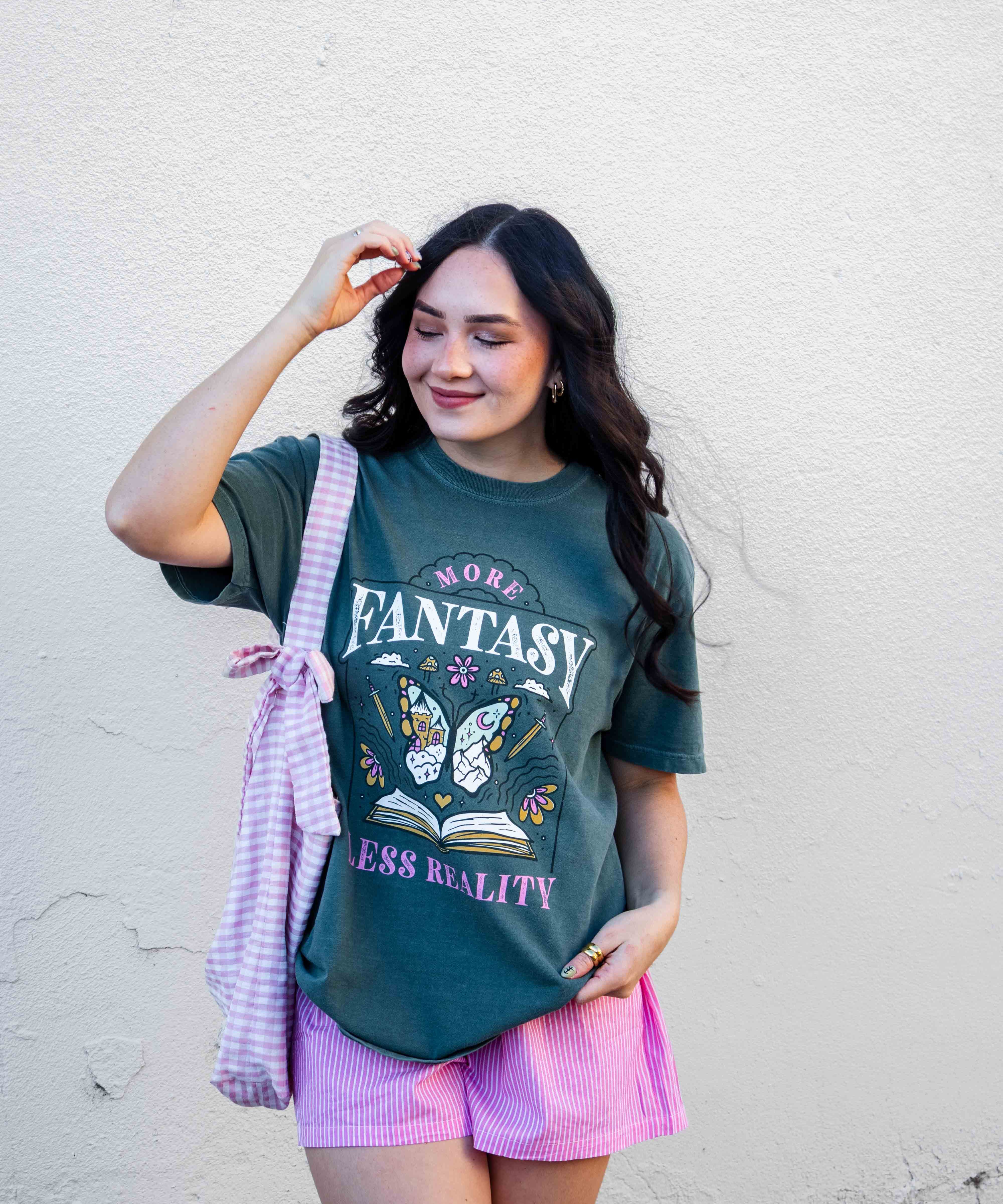 A green t-shirt More Fantasy Less Reality, with a bookish graphic, Fantasy Romance merch, Gift for readers