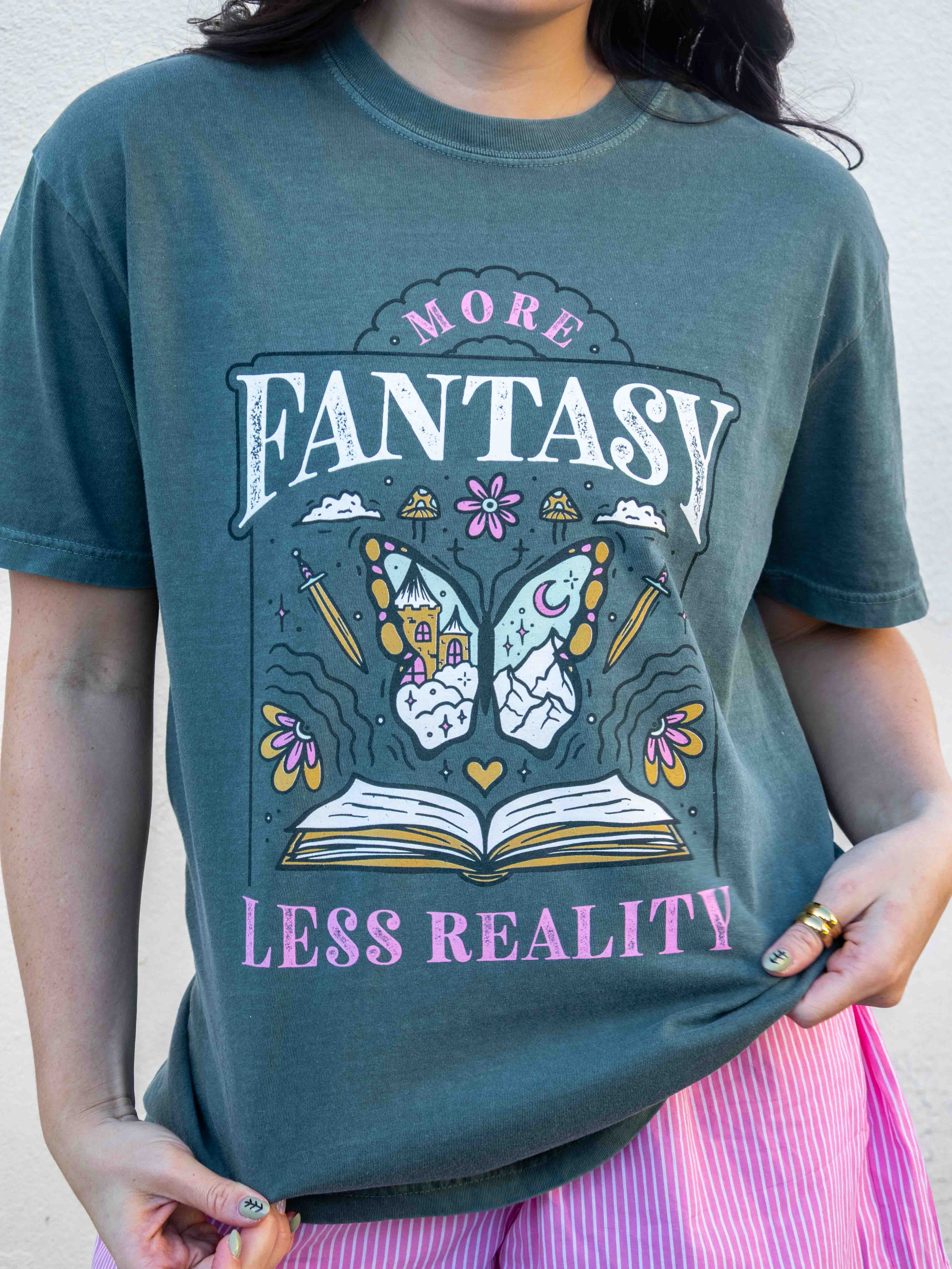 A green t-shirt More Fantasy Less Reality, with a bookish graphic, Fantasy Romance merch, Gift for readers