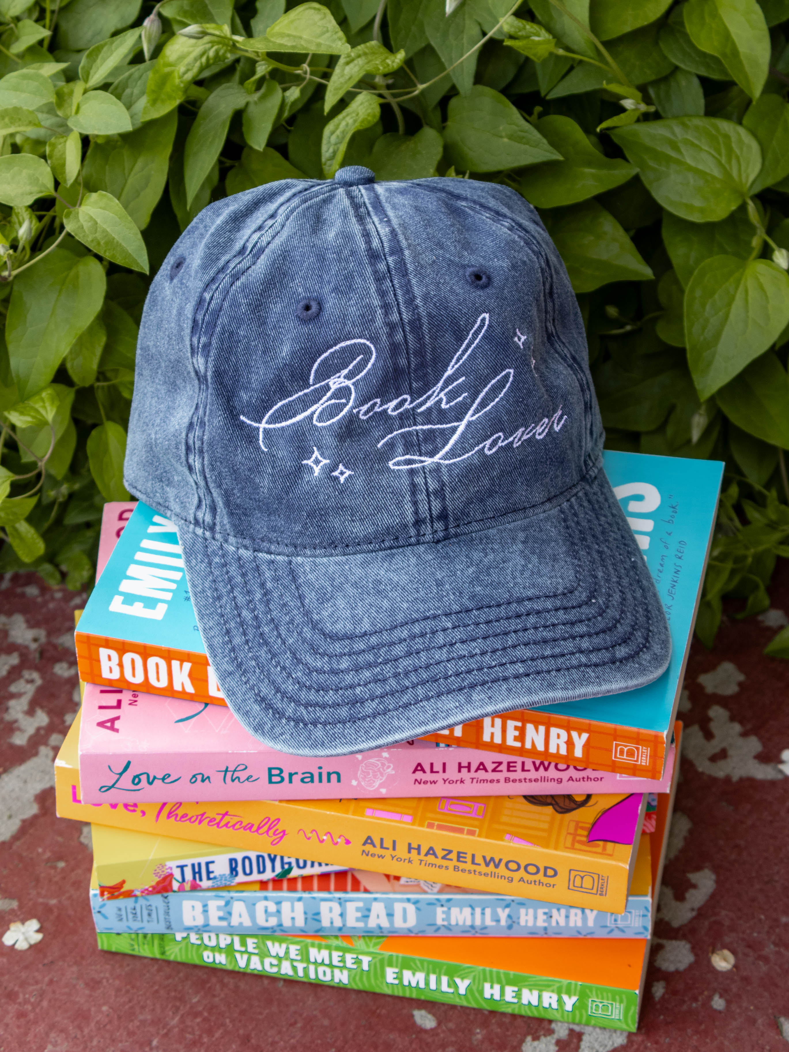 Book Lover dad hat vintage denim wash embroidered design, adjustable strap blossom and book