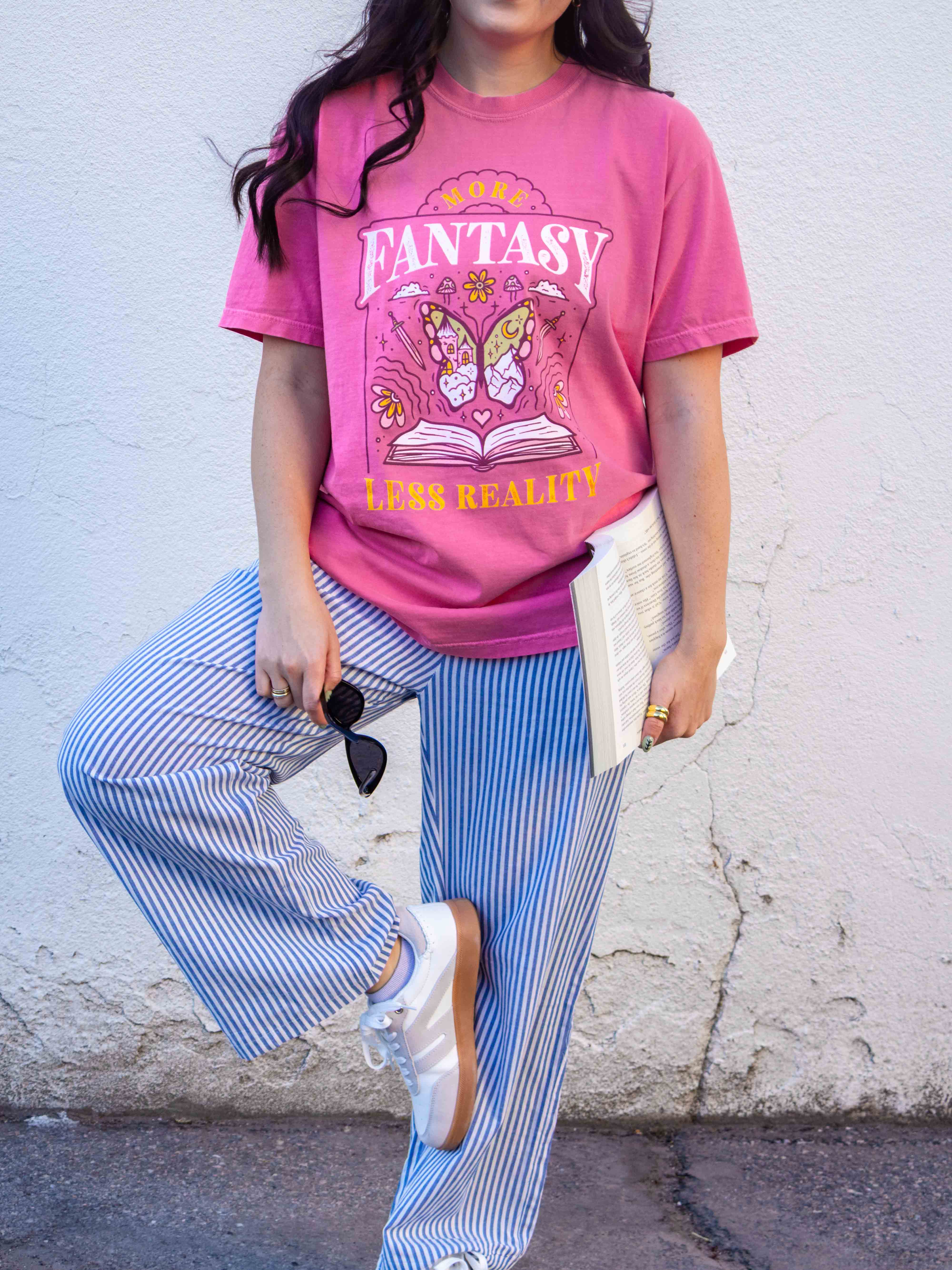 A pink t-shirt More Fantasy Less Reality, with a bookish graphic, Fantasy Romance merch, Gift for readers