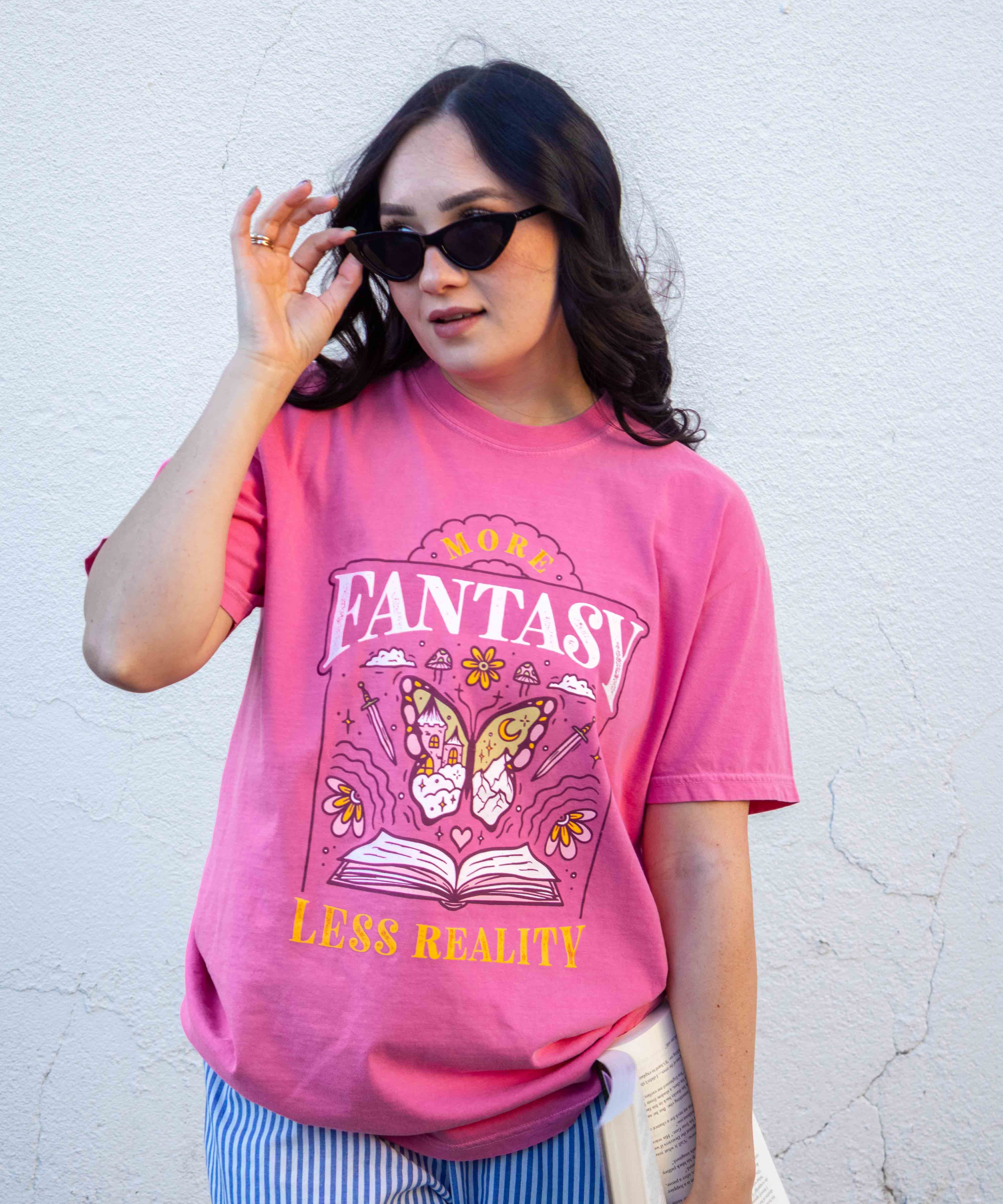 A pink t-shirt More Fantasy Less Reality, with a bookish graphic, Fantasy Romance merch, Gift for readers