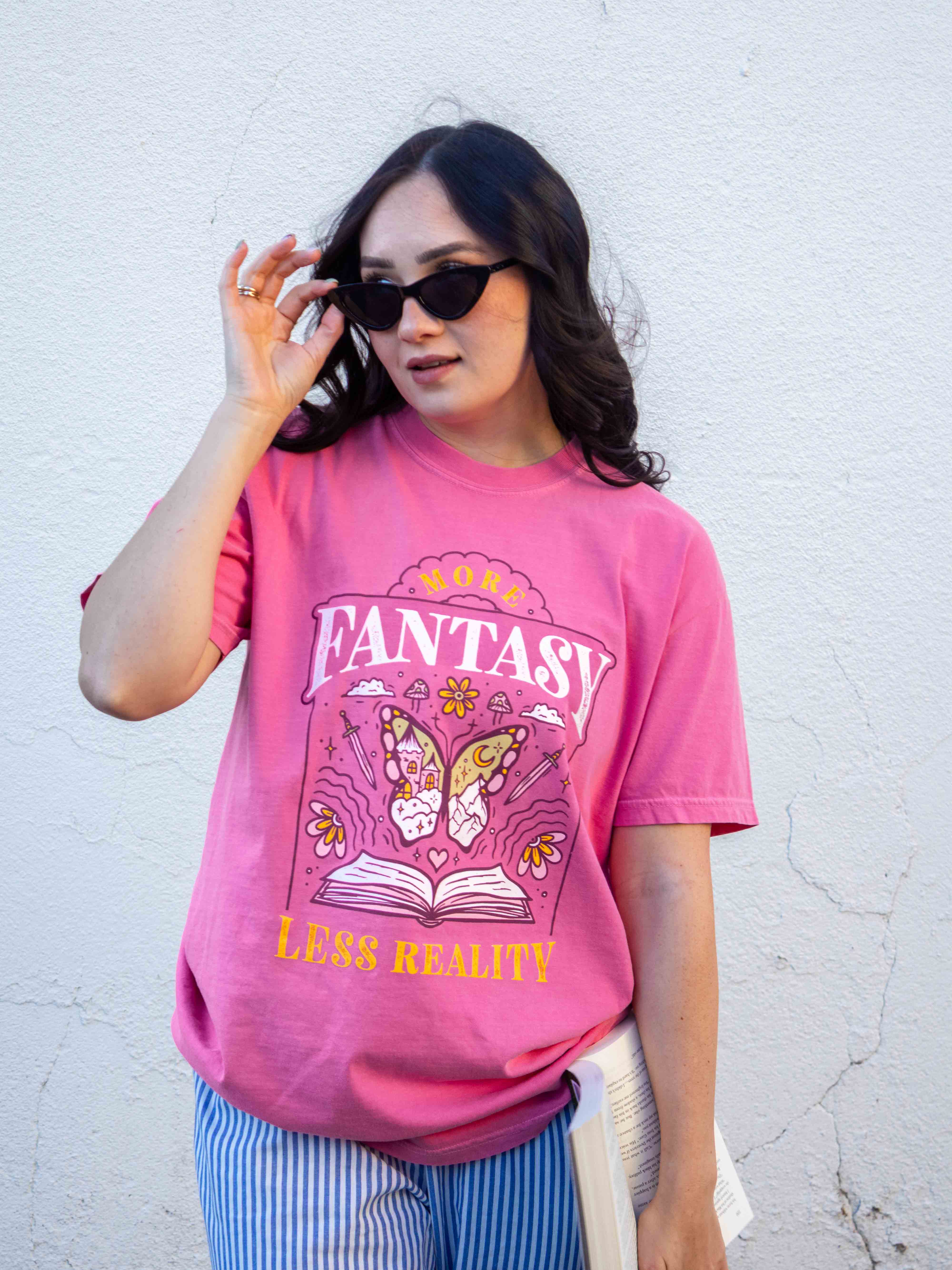 A pink t-shirt More Fantasy Less Reality, with a bookish graphic, Fantasy Romance merch, Gift for readers